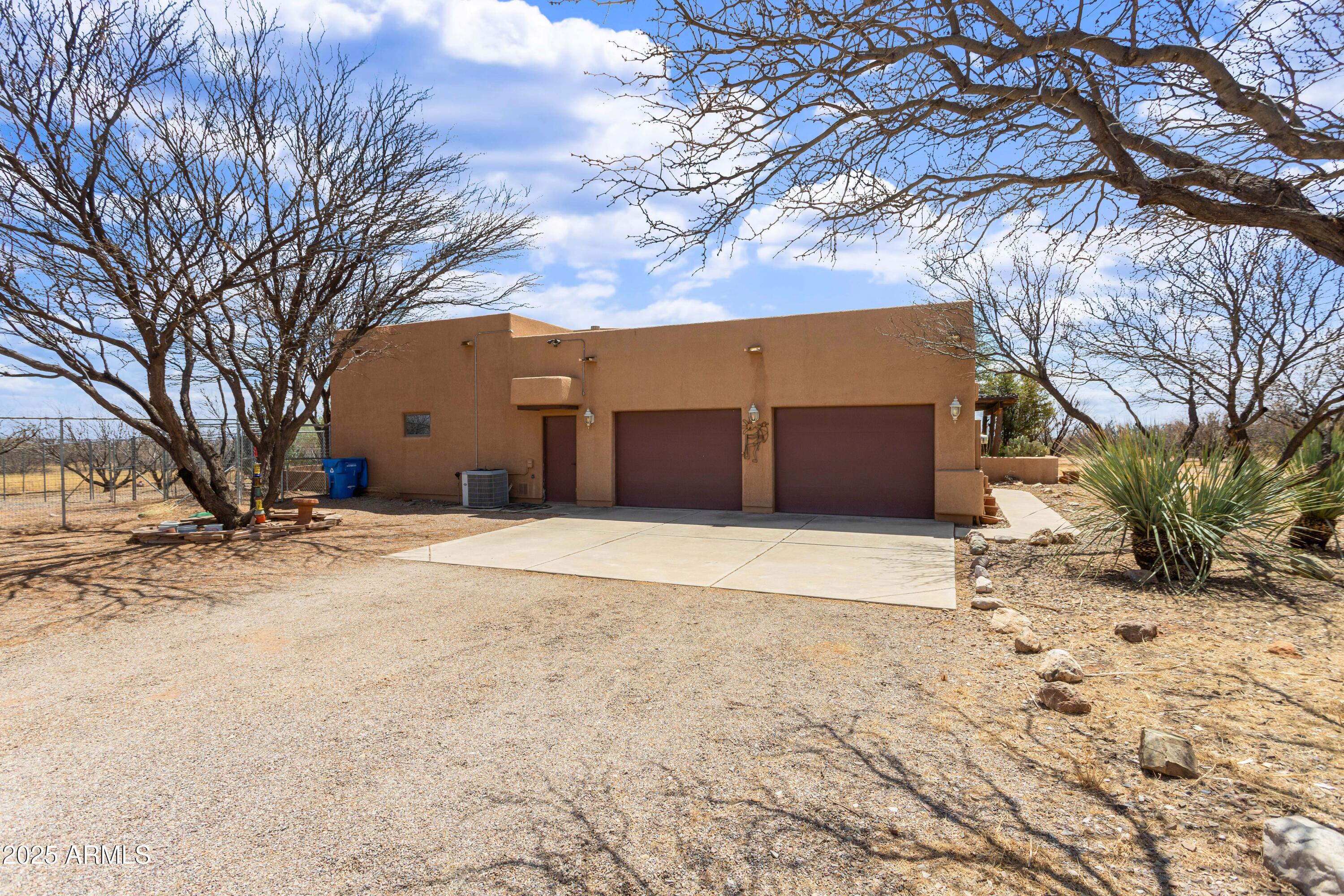 8765 South Airstrip Road Hereford, AZ 85615 - Photo 41 of 47 a house with trees in front of it