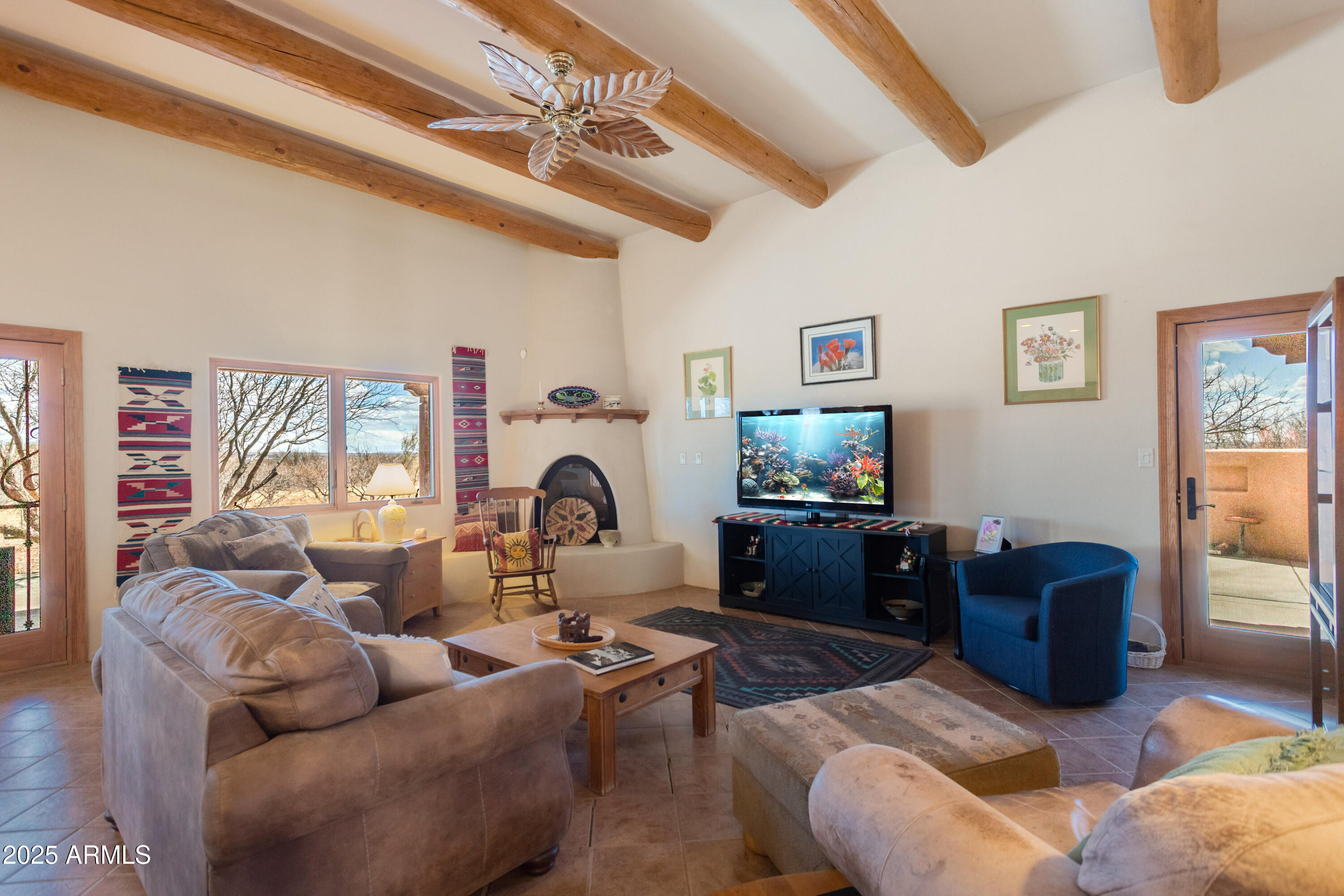 8765 South Airstrip Road Hereford, AZ 85615 - Photo 9 of 47 a living room with furniture a rug and a window