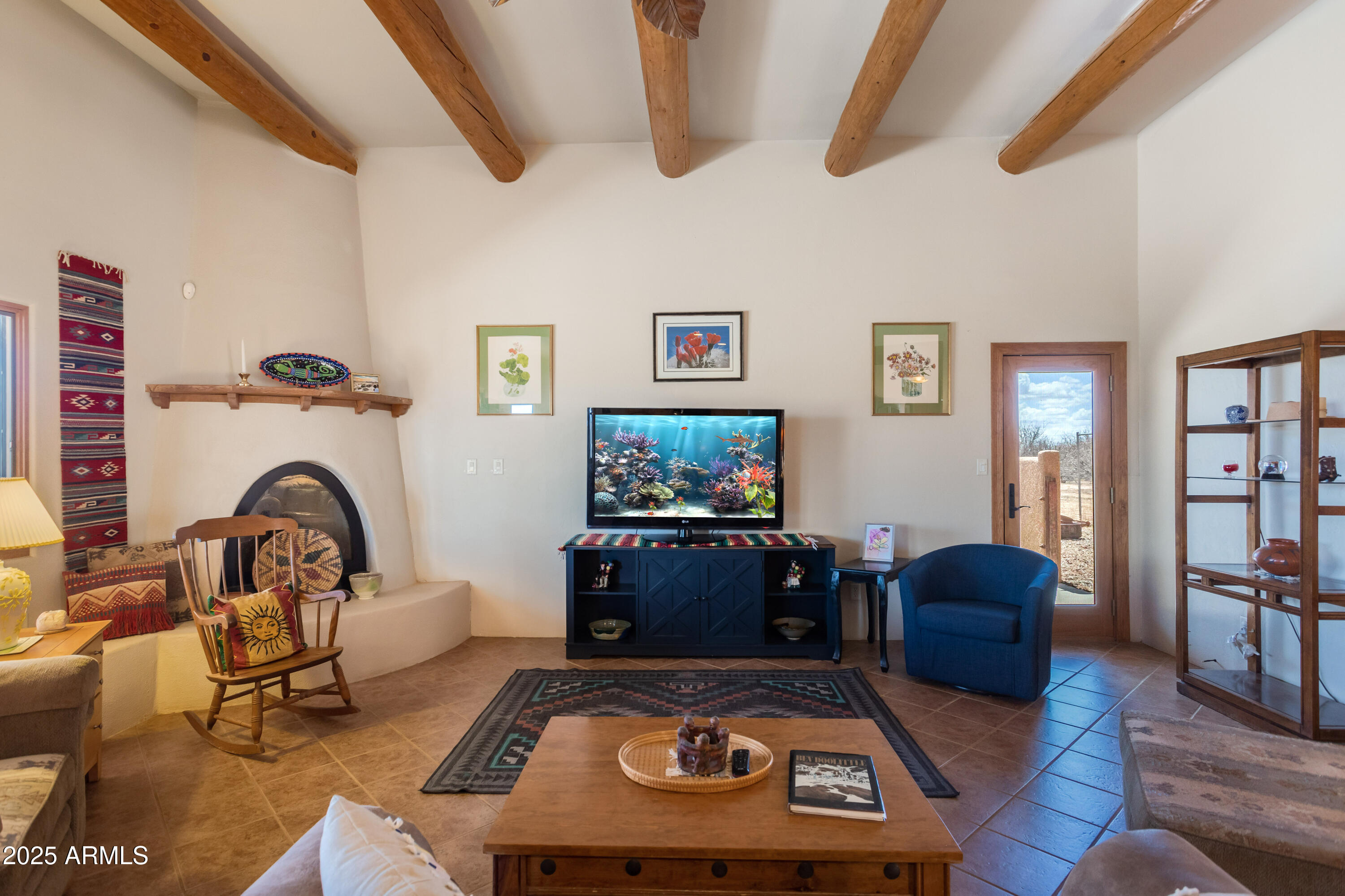 8765 South Airstrip Road Hereford, AZ 85615 - Photo 10 of 47 a living room with furniture and a flat screen tv
