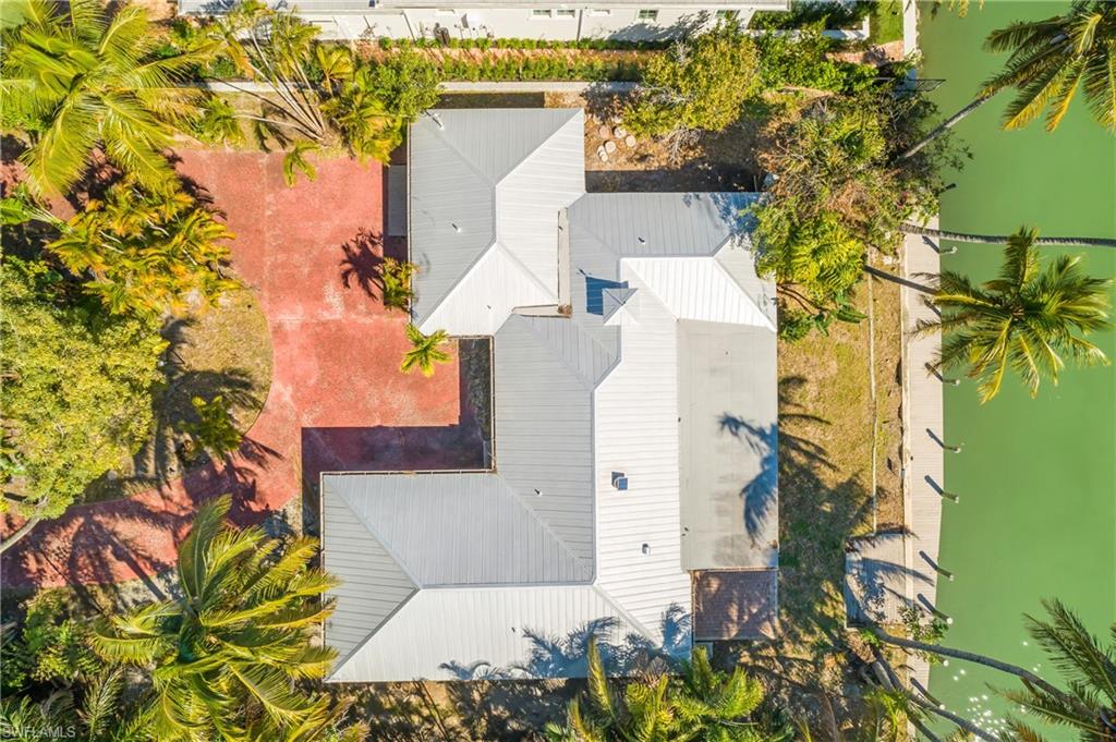 2195 Sheepshead Drive Naples, FL 34102 - Photo 12 of 14 front view of a house with a yard