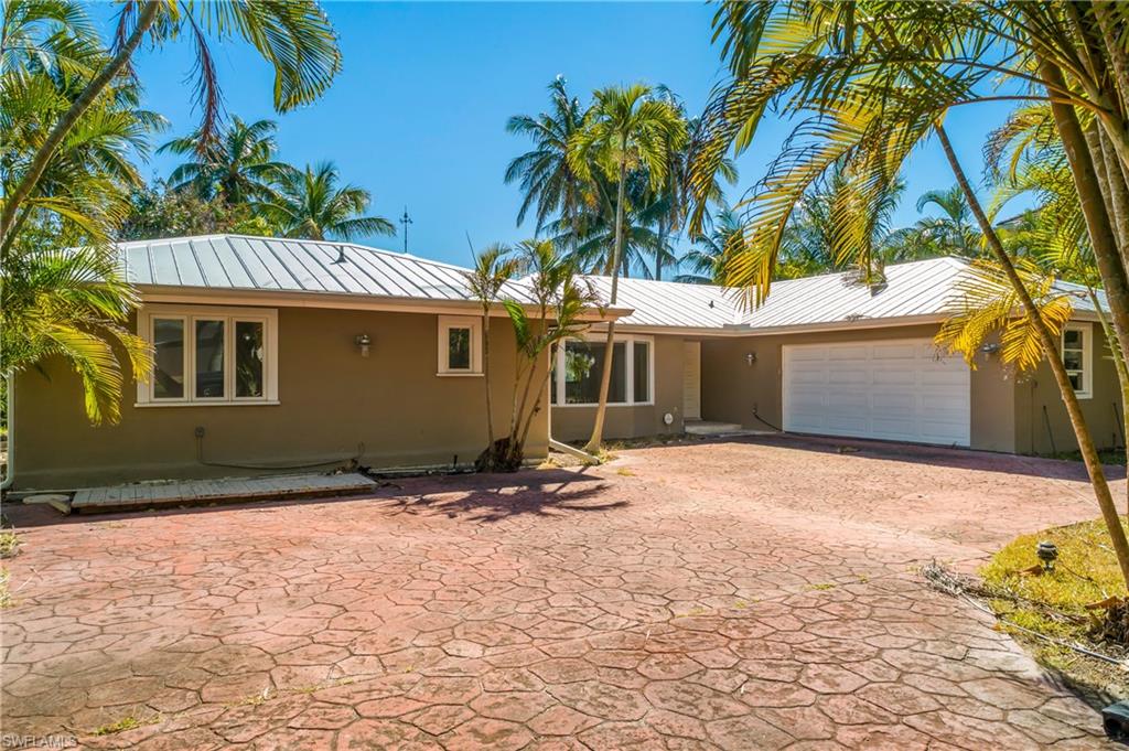 2195 Sheepshead Drive Naples, FL 34102 - Photo 14 of 14 a view of a house with a yard