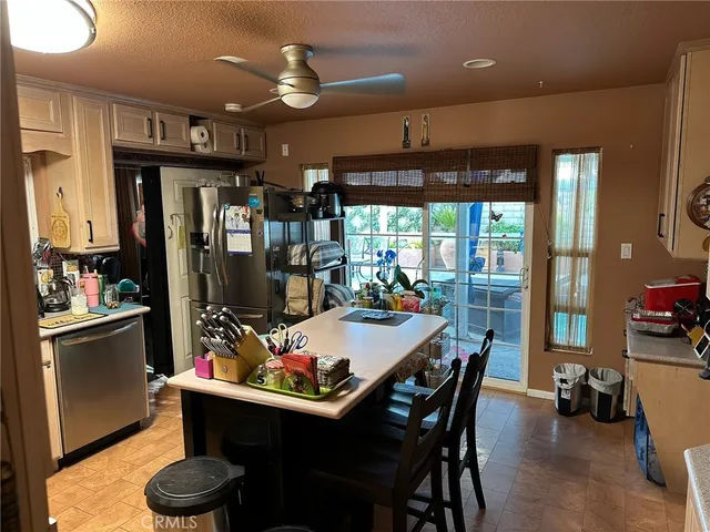 a dining room with a table and chairs