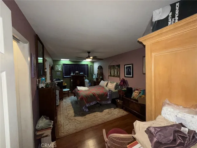 a living room with furniture and a lamp