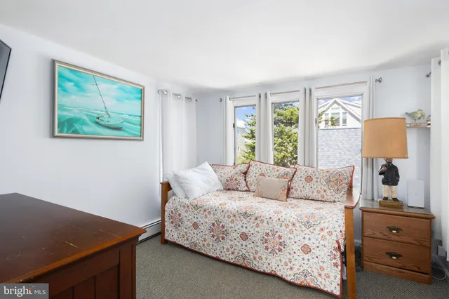 a roof deck with table and chairs
