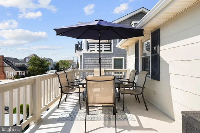 a view of balcony with furniture