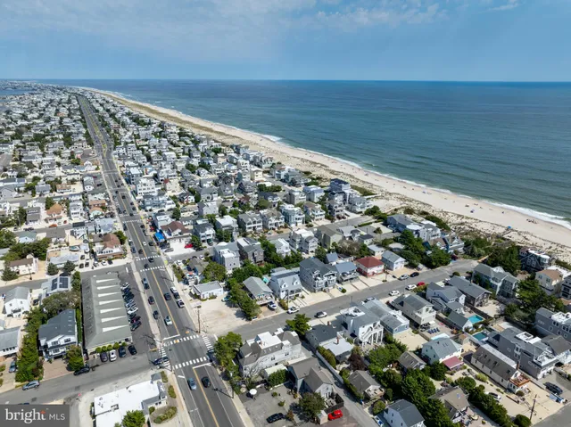 an aerial view of a city with ocean view
