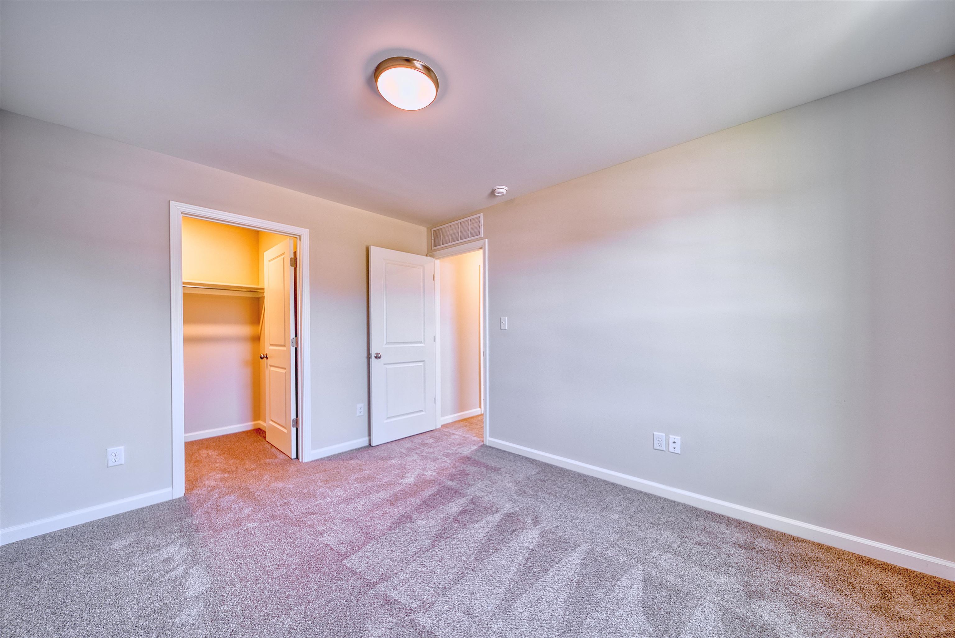 196 Como Lane Atoka, TN 38004 - Photo 28 of 40 Unfurnished bedroom featuring a spacious closet and carpet