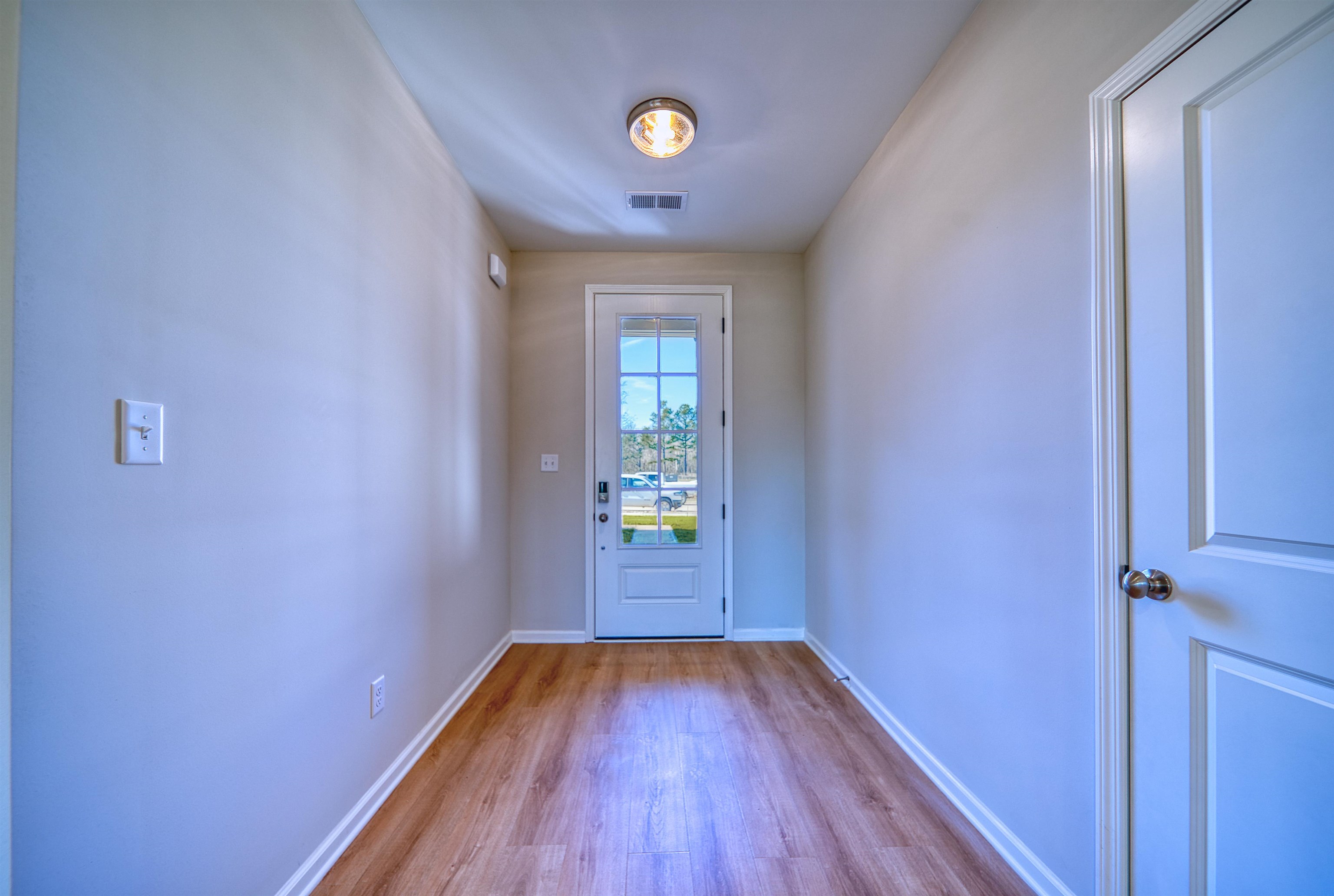 196 Como Lane Atoka, TN 38004 - Photo 4 of 40 a view of empty room with wooden floor