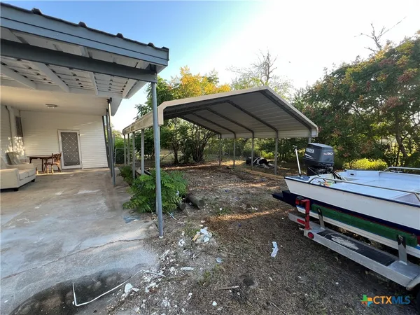 a view of a yard with an outdoor space