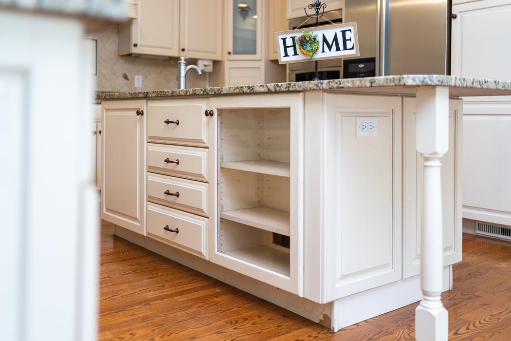 1068 Entry School Road Fishersville, VA 22939 - Photo 36 of 74 a kitchen with granite countertop a sink and cabinets