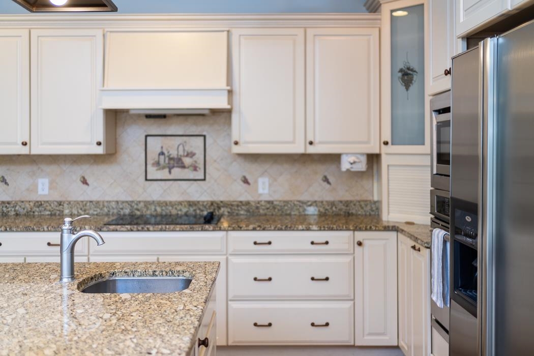 1068 Entry School Road Fishersville, VA 22939 - Photo 37 of 74 a kitchen with granite countertop white cabinets and a sink