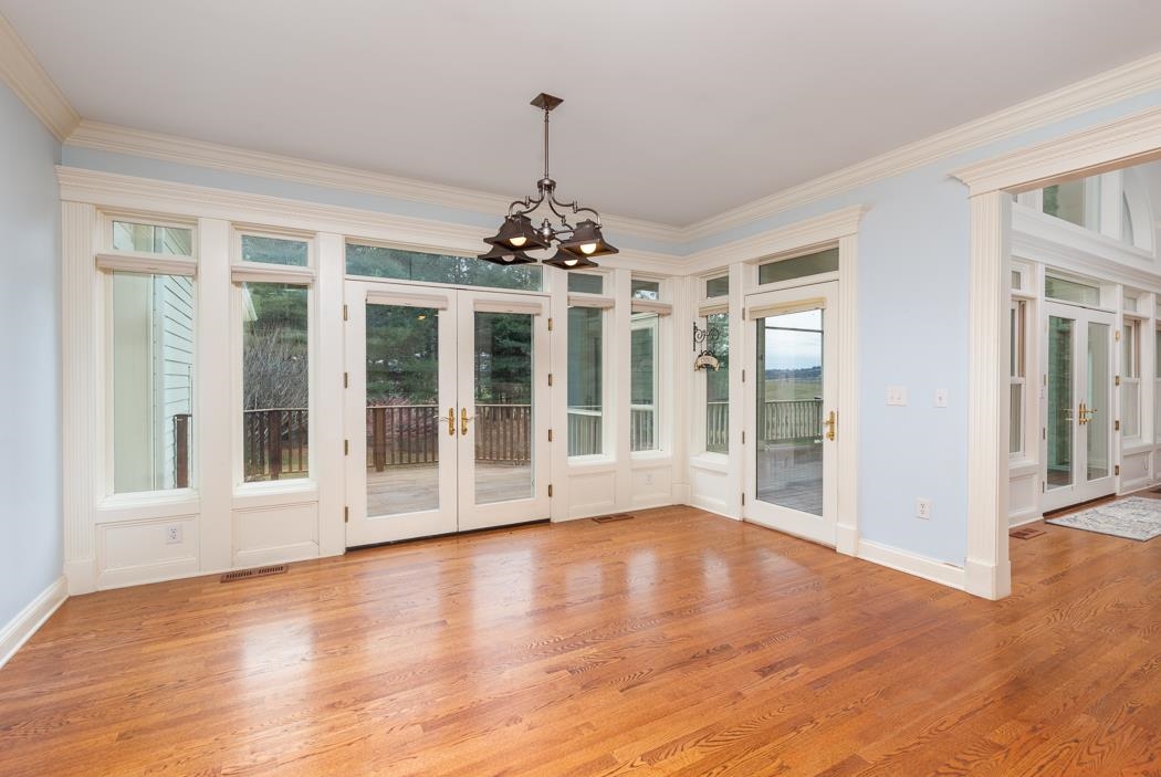 1068 Entry School Road Fishersville, VA 22939 - Photo 40 of 74 a view of an empty room with wooden floor and a window