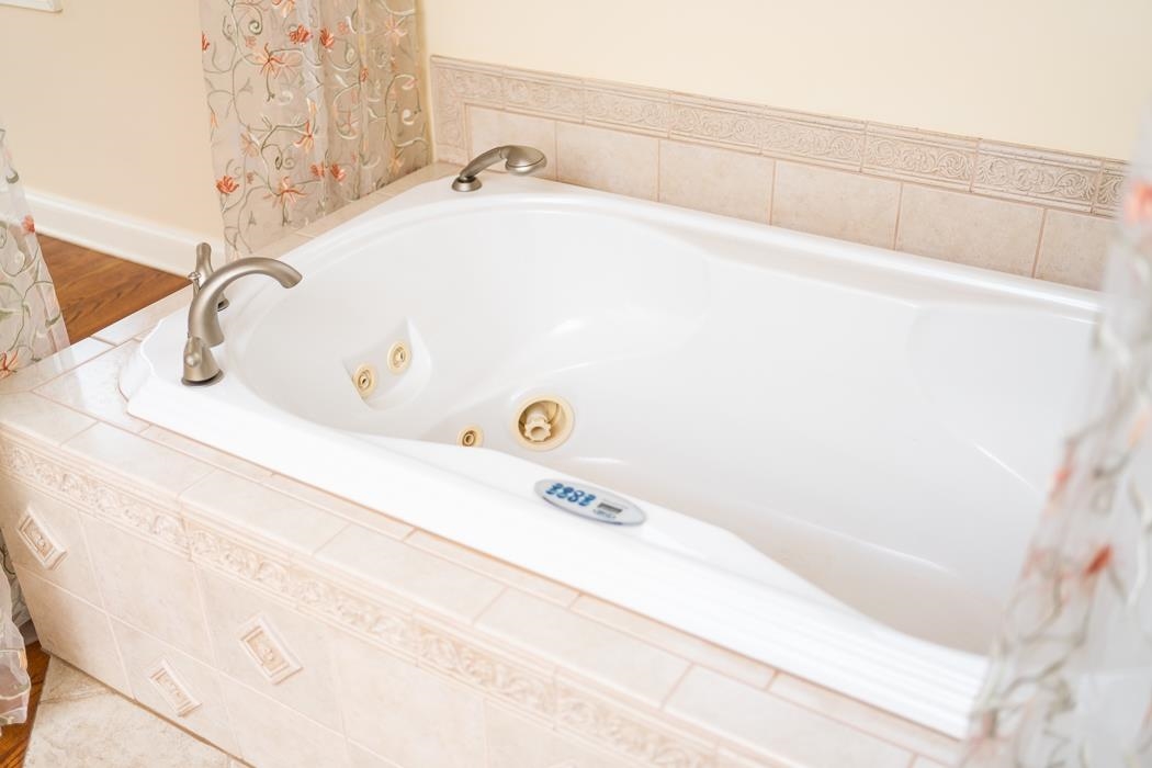 1068 Entry School Road Fishersville, VA 22939 - Photo 42 of 74 a bathroom with a tub and a sink