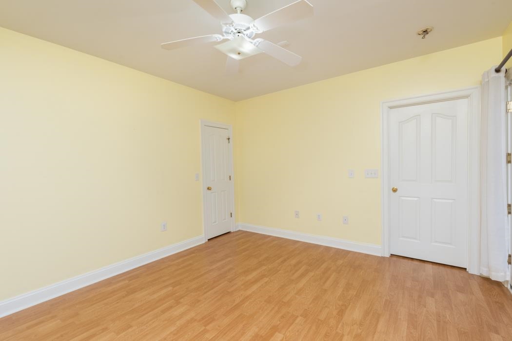 1068 Entry School Road Fishersville, VA 22939 - Photo 65 of 74 an empty room with a ceiling fan and a window