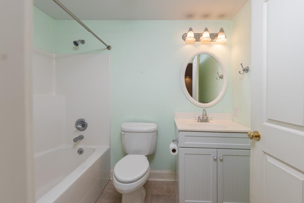1068 Entry School Road Fishersville, VA 22939 - Photo 67 of 74 a bathroom with a sink a toilet and a mirror