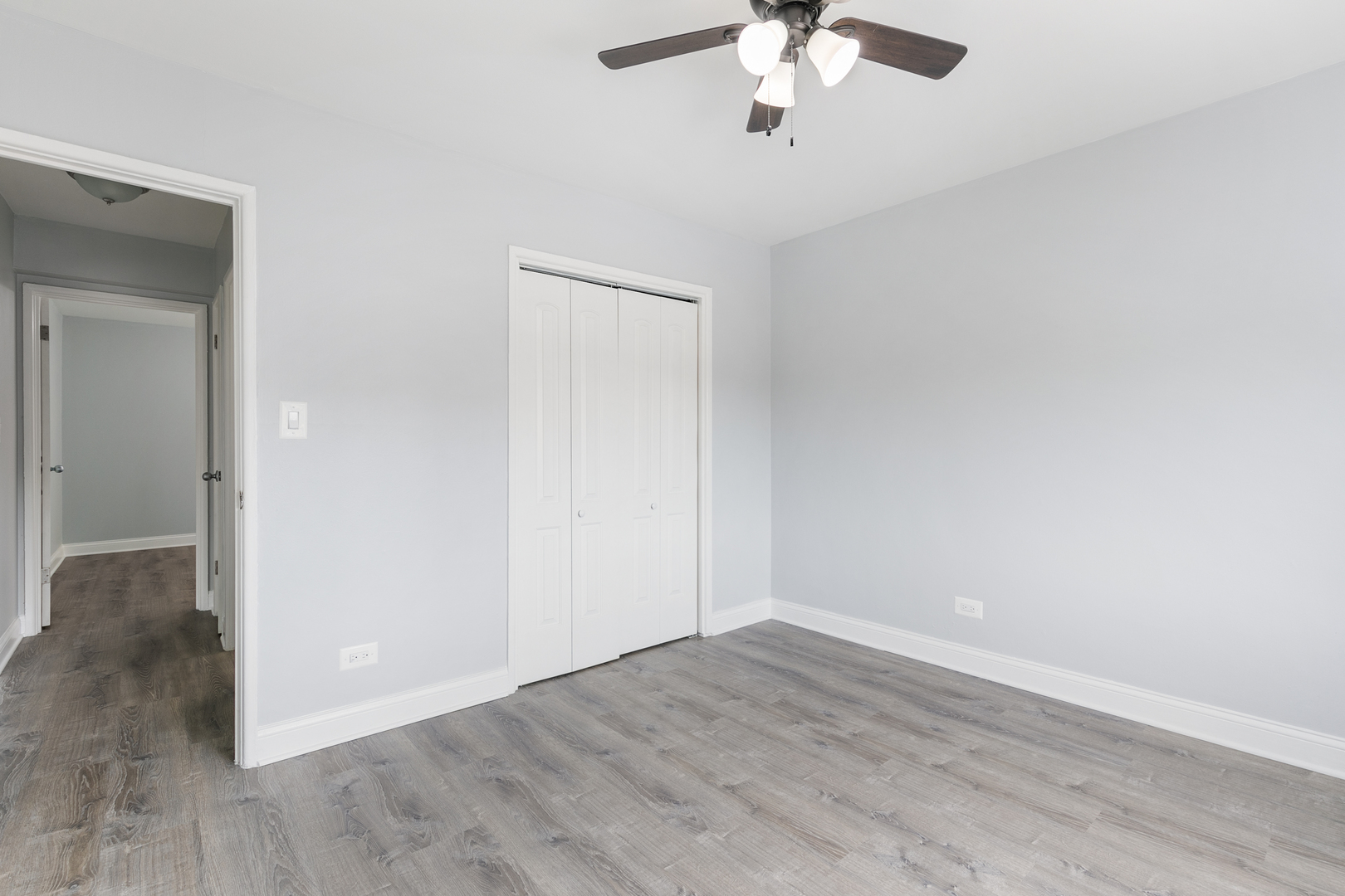 6826 North Ridge Boulevard, Unit 404 Chicago, IL 60645 - Photo 9 of 17 wooden floor in an empty room