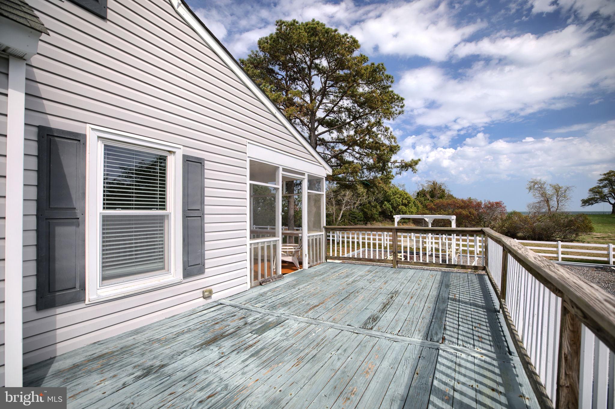 1887 Point Breeze Road Hudgins, VA 23076 - Photo 68 of 77 a view of a house with a roof deck
