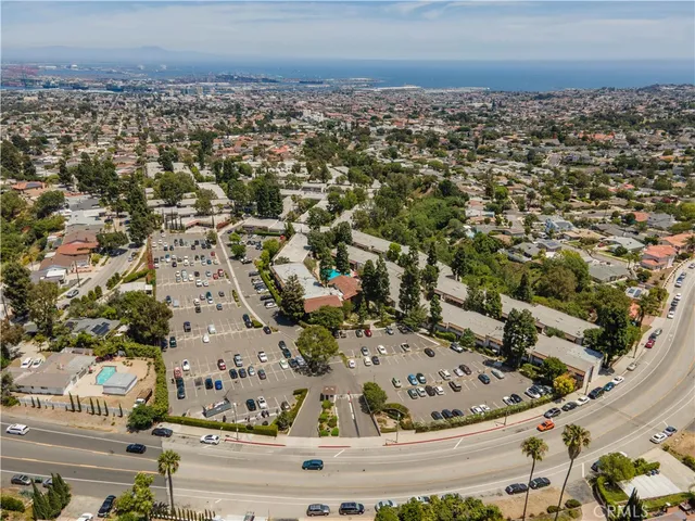 a view of a backyard with sitting area furniture and garden