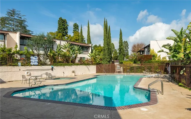 a front view of a house with tree s