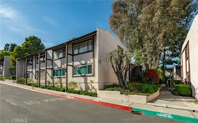 a living room with furniture large window and wooden floor