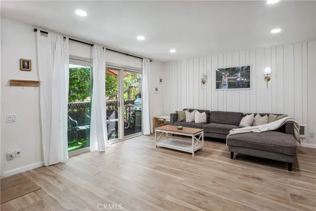 a living room with furniture and large window