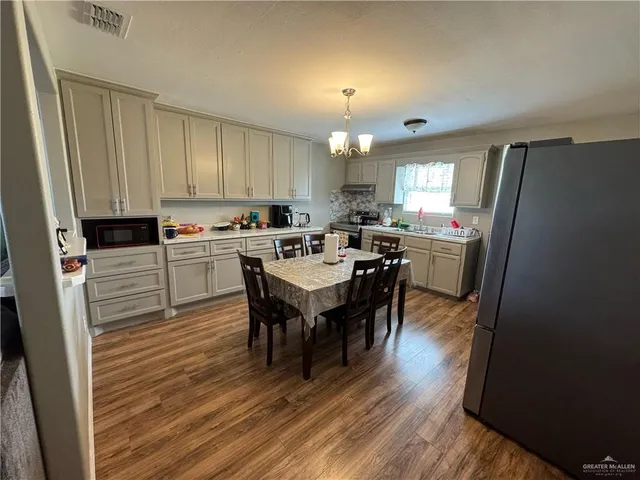 a view of a dining room with furniture and window