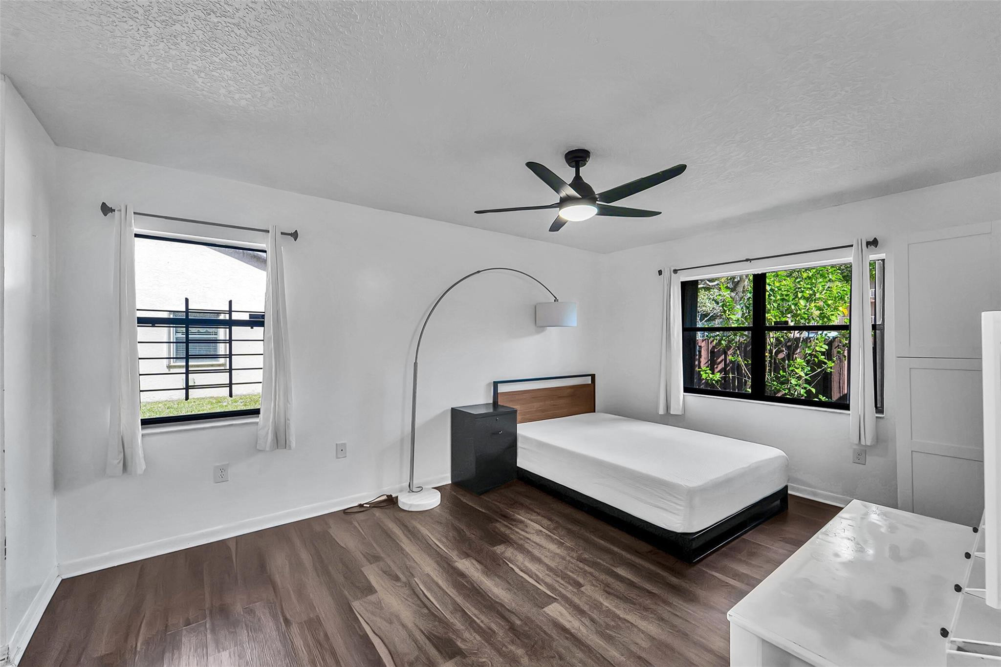 2698 North Nob Hill Road Sunrise, FL 33322 - Photo 14 of 27 a bedroom with a bed and a window