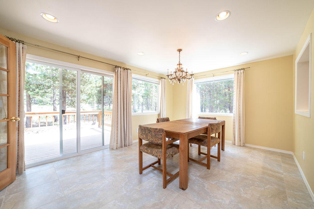 16944 Downey Road Bend, OR 97707 - Photo 14 of 44 a view of a dining room with furniture window and outside view