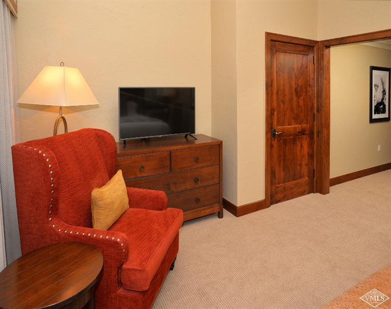 100 Bachelor Ridge Road, Unit 3704 Avon, CO 81620 - Photo 14 of 21 a living room with furniture and a flat screen tv