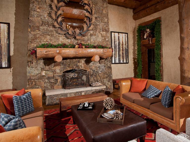 100 Bachelor Ridge Road, Unit 3704 Avon, CO 81620 - Photo 18 of 21 a living room with furniture and a fireplace
