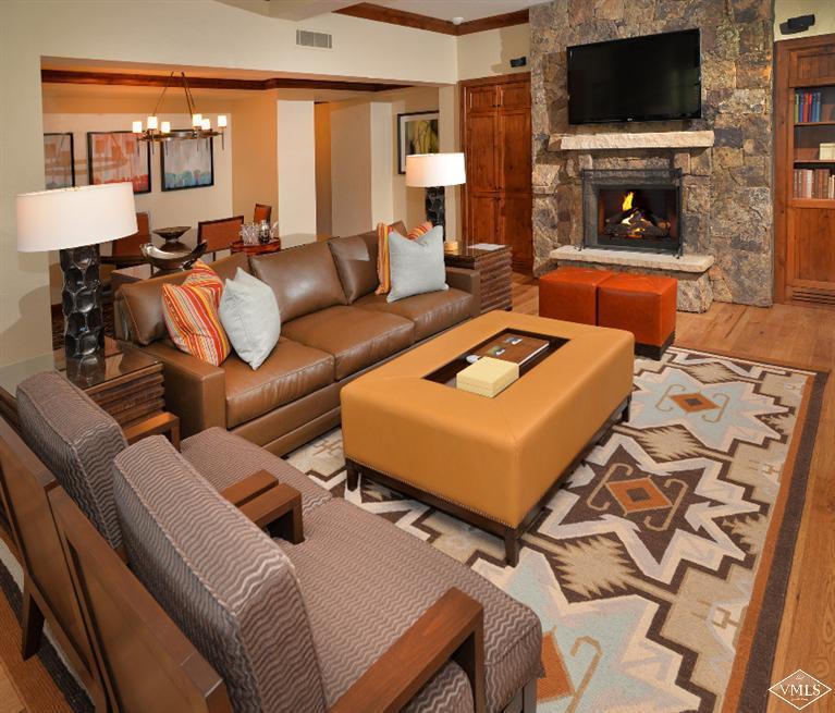 100 Bachelor Ridge Road, Unit 3704 Avon, CO 81620 - Photo 2 of 21 a living room with furniture and a flat screen tv