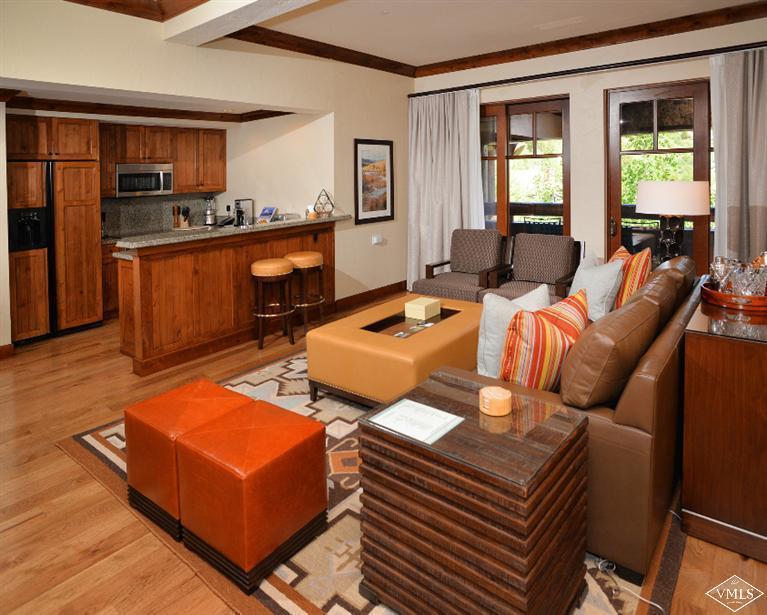 100 Bachelor Ridge Road, Unit 3704 Avon, CO 81620 - Photo 3 of 21 a living room with furniture a rug and a window