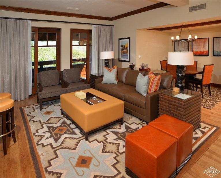 100 Bachelor Ridge Road, Unit 3704 Avon, CO 81620 - Photo 4 of 21 a living room with furniture a rug and a lamp