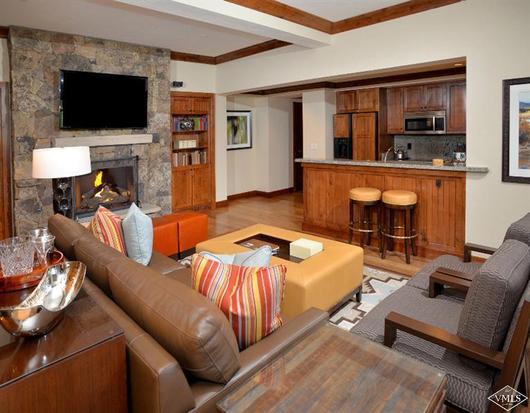 100 Bachelor Ridge Road, Unit 3704 Avon, CO 81620 - Photo 5 of 21 a living room with furniture and a flat screen tv