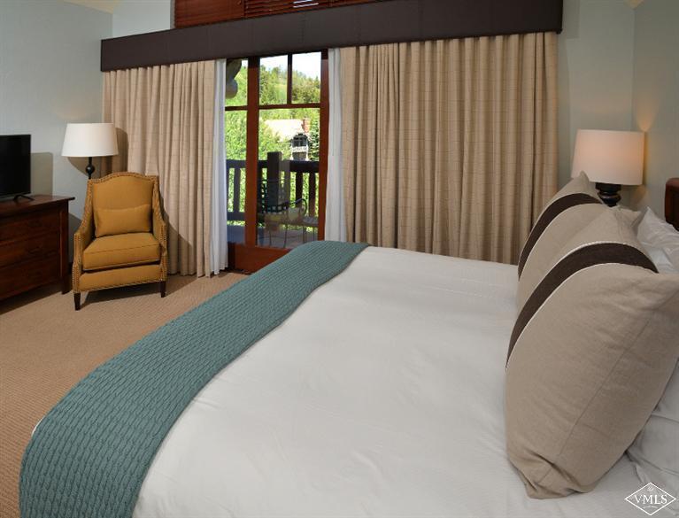 100 Bachelor Ridge Road, Unit 3704 Avon, CO 81620 - Photo 8 of 21 a bedroom with a bed and lamp