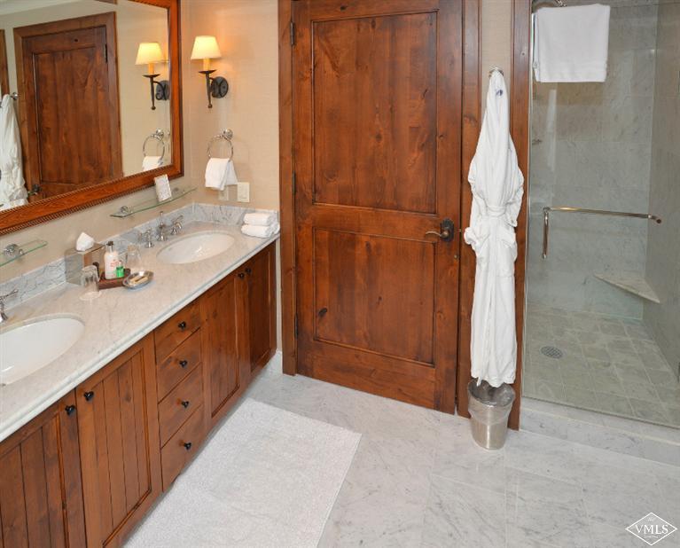 100 Bachelor Ridge Road, Unit 3704 Avon, CO 81620 - Photo 10 of 21 a bathroom with a double vanity sink and mirror