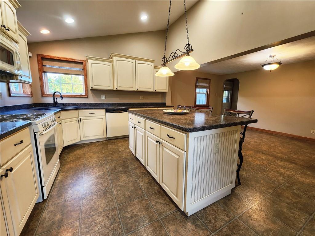 289 Scotland Lane New Castle, PA 16101 - Photo 12 of 35 a kitchen with stainless steel appliances granite countertop a stove a sink and a refrigerator