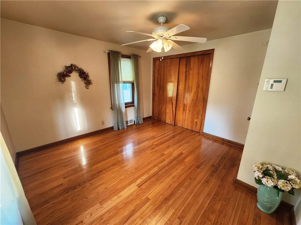 289 Scotland Lane New Castle, PA 16101 - Photo 19 of 35 wooden floor in an empty room with a window