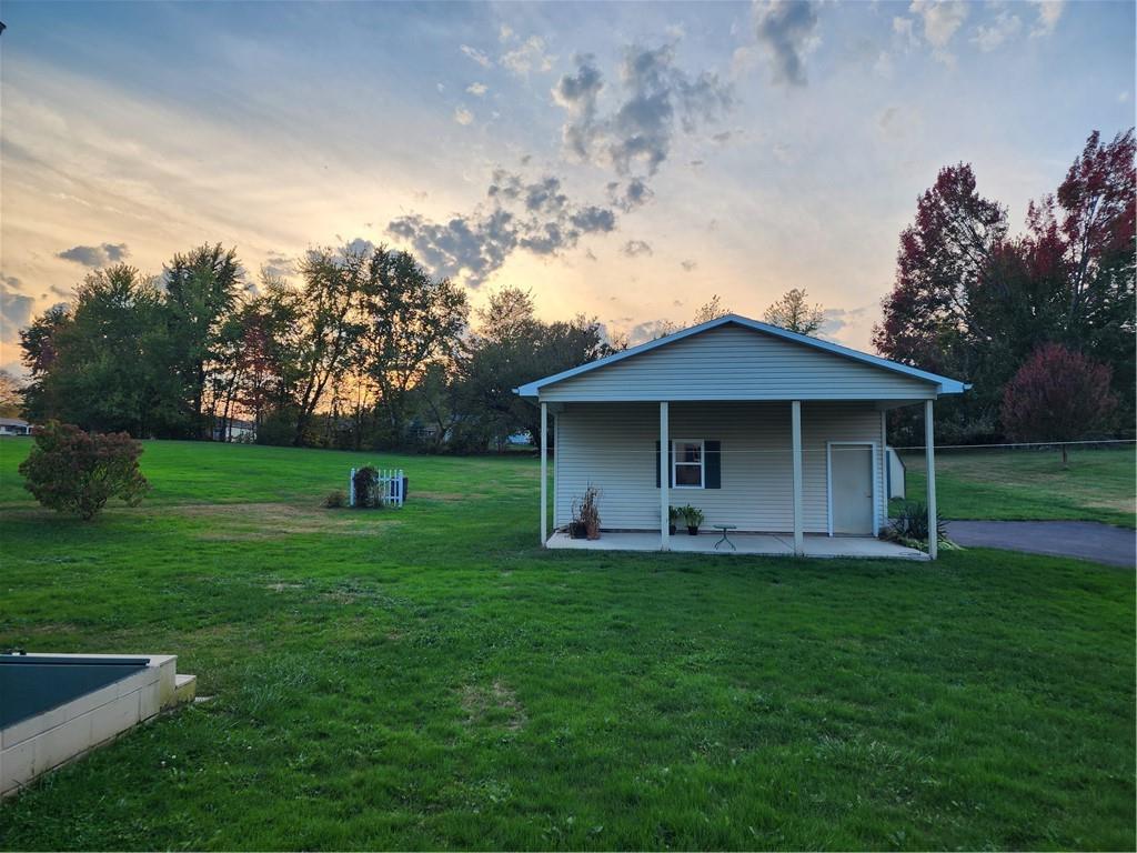289 Scotland Lane New Castle, PA 16101 - Photo 32 of 35 a view of a yard in front of a house with a large tree