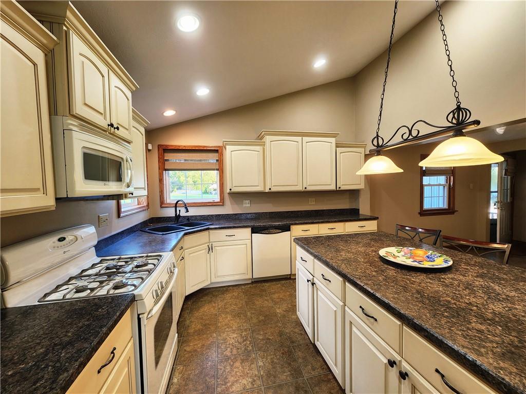 289 Scotland Lane New Castle, PA 16101 - Photo 10 of 35 a kitchen with a stove a sink and a refrigerator