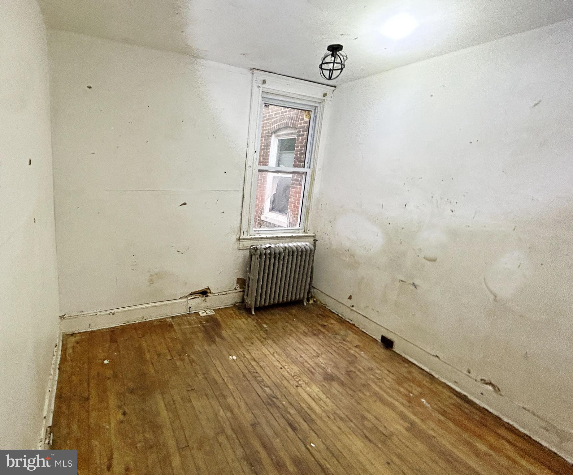2904 Winchester Street Baltimore, MD 21216 - Photo 14 of 17 an empty room with windows