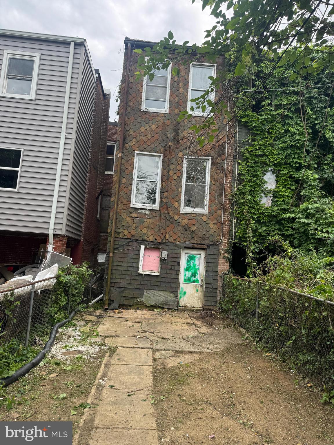 2904 Winchester Street Baltimore, MD 21216 - Photo 3 of 17 a front view of a house with a yard