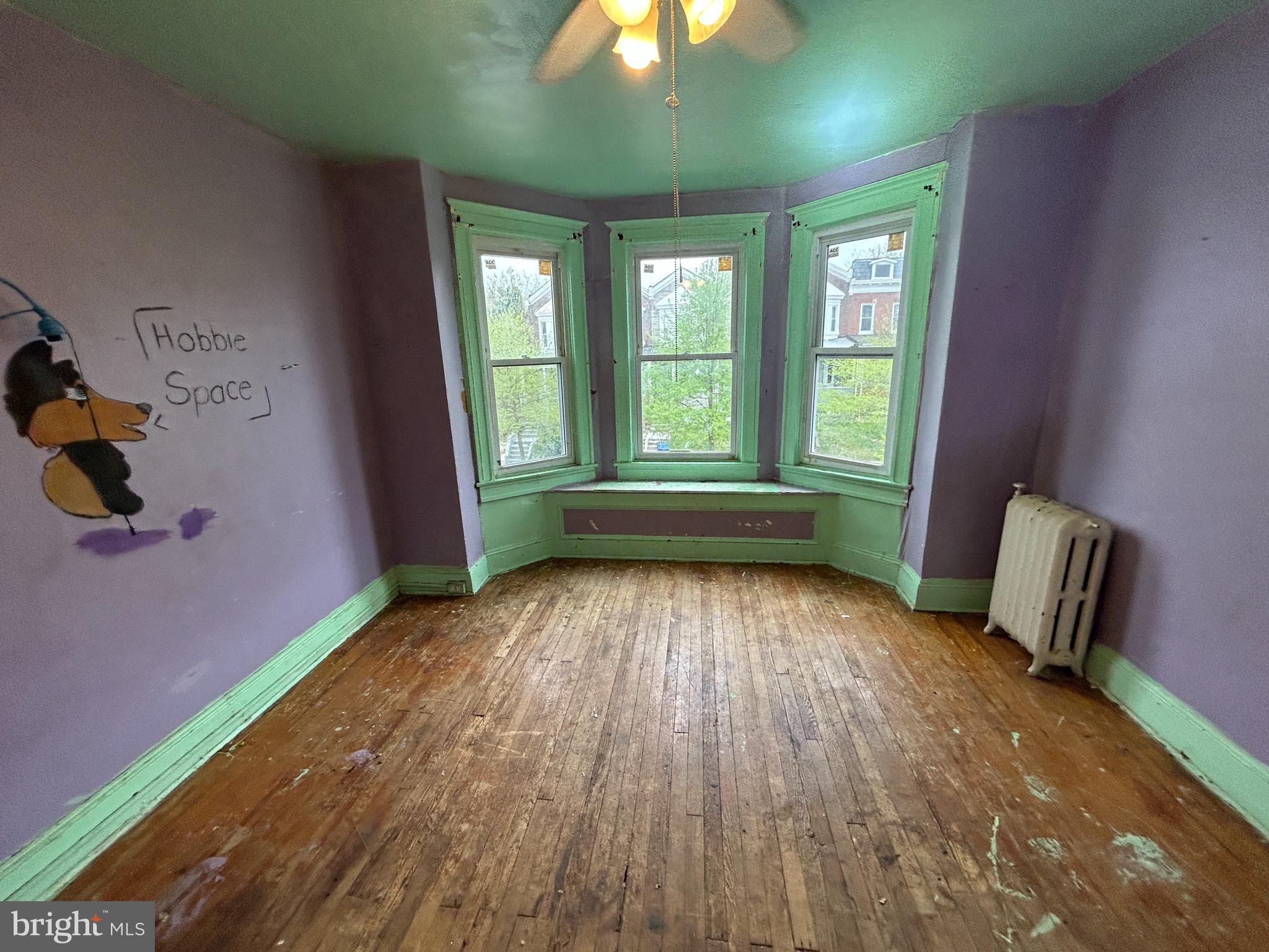 2904 Winchester Street Baltimore, MD 21216 - Photo 10 of 17 a view of room with window and wooden floor