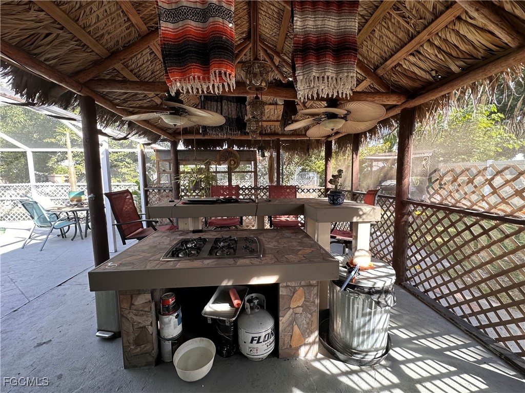 120 Rowland Road Lehigh Acres, FL 33936 - Photo 20 of 21 a view of a chairs and table in a patio