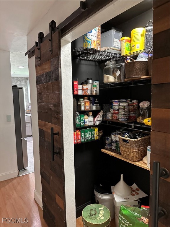 120 Rowland Road Lehigh Acres, FL 33936 - Photo 6 of 21 a kitchen with a stove and a refrigerator