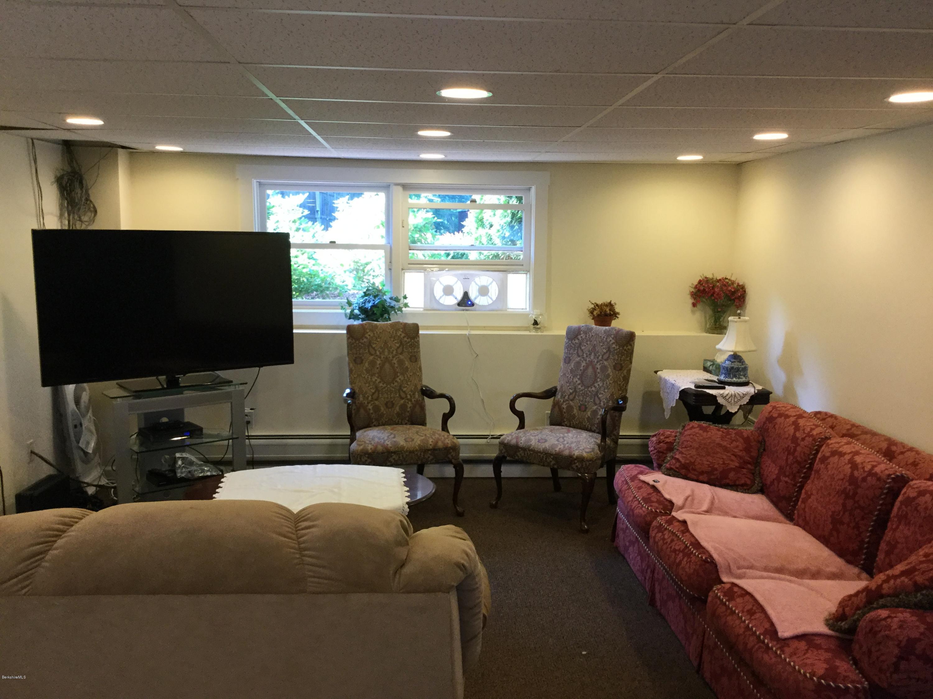 355 Salisbury Road Sheffield, MA 01257 - Photo 18 of 33 a living room with furniture and a flat screen tv