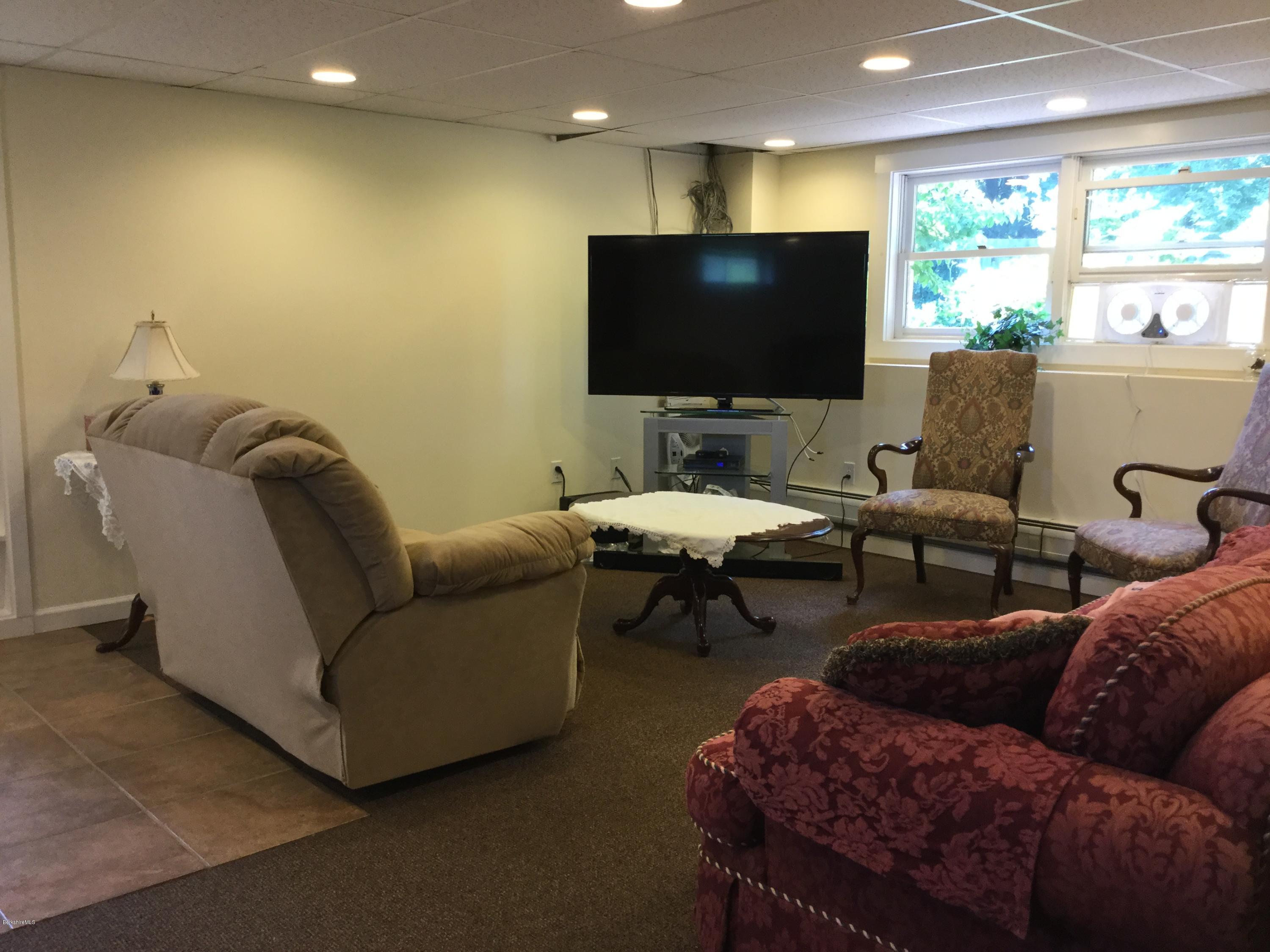 355 Salisbury Road Sheffield, MA 01257 - Photo 19 of 33 a living room with furniture and a flat screen tv