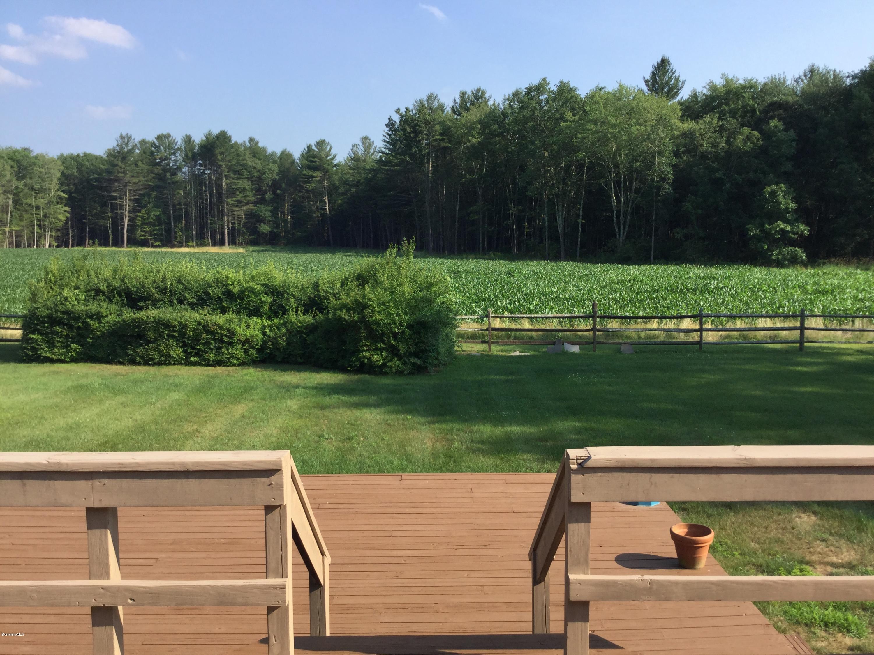 355 Salisbury Road Sheffield, MA 01257 - Photo 28 of 33 a view of a wooden deck and garden
