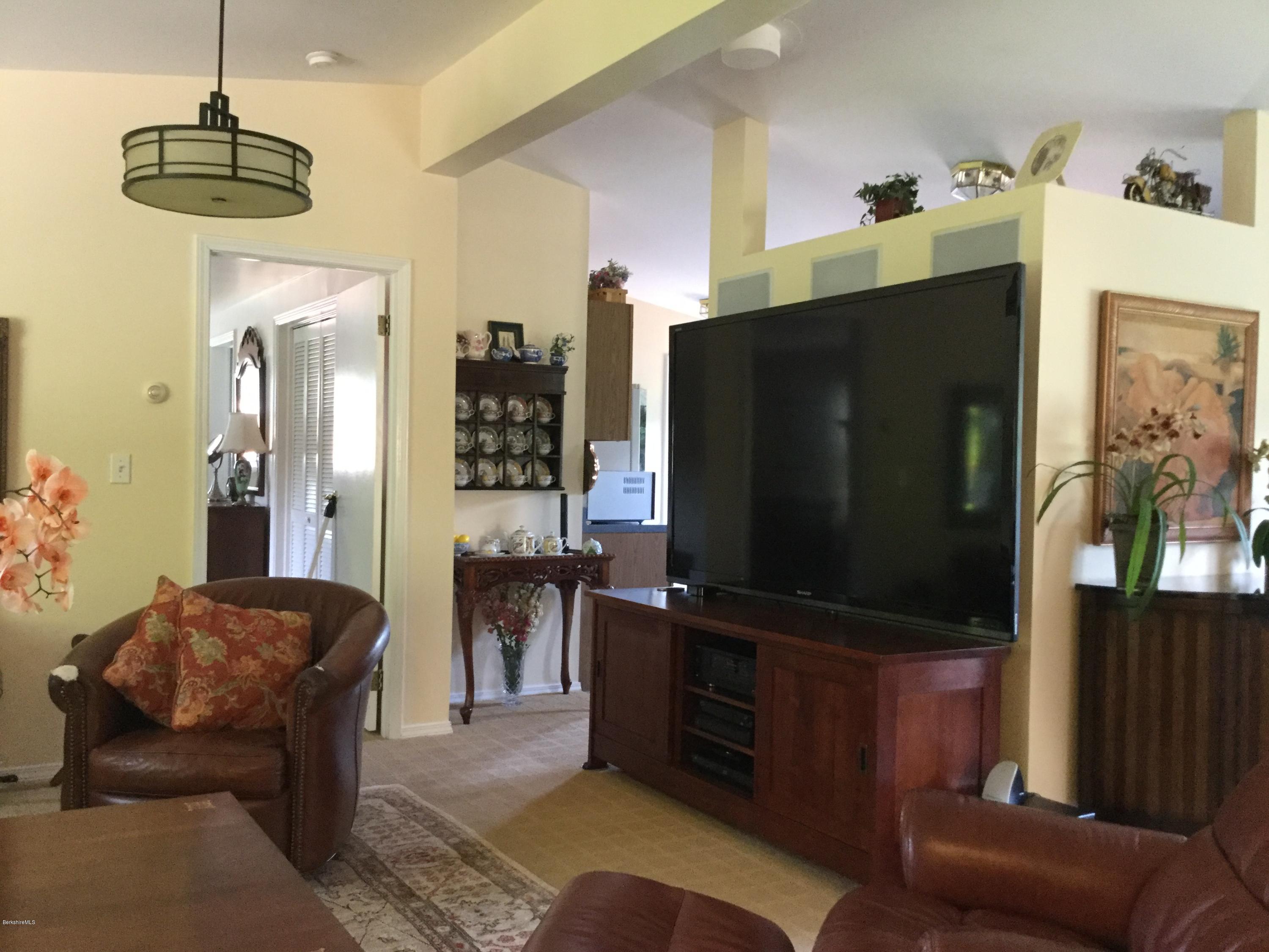 355 Salisbury Road Sheffield, MA 01257 - Photo 8 of 33 a living room with furniture and a flat screen tv