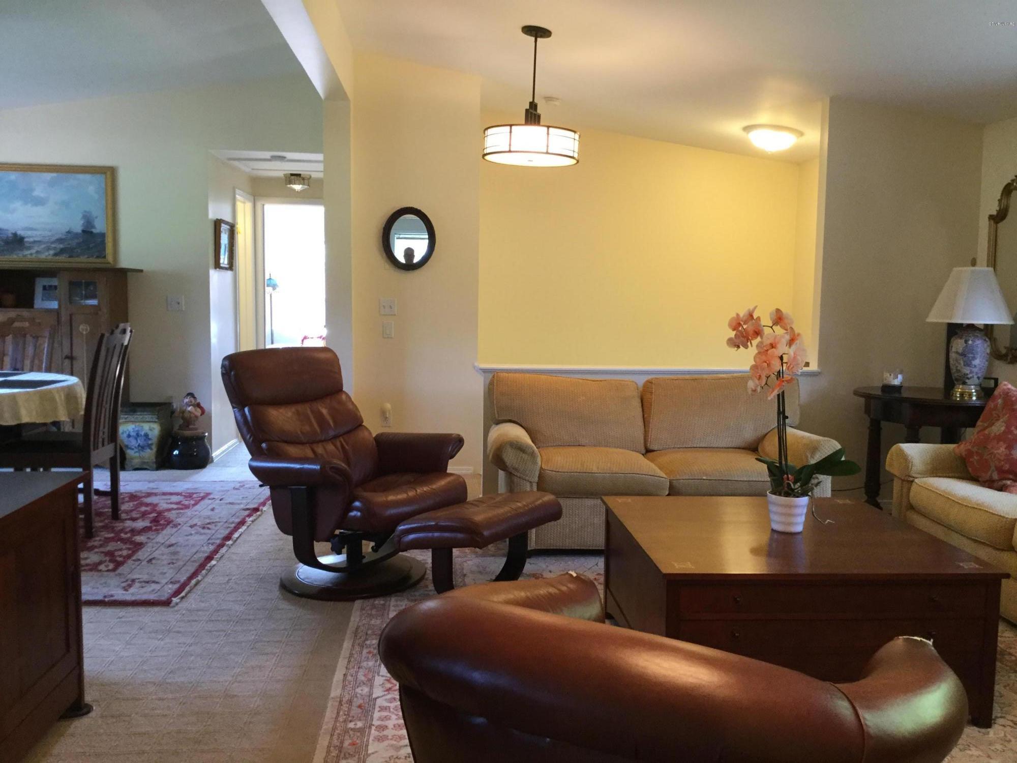 355 Salisbury Road Sheffield, MA 01257 - Photo 9 of 33 a living room with furniture a fireplace and a flat screen tv